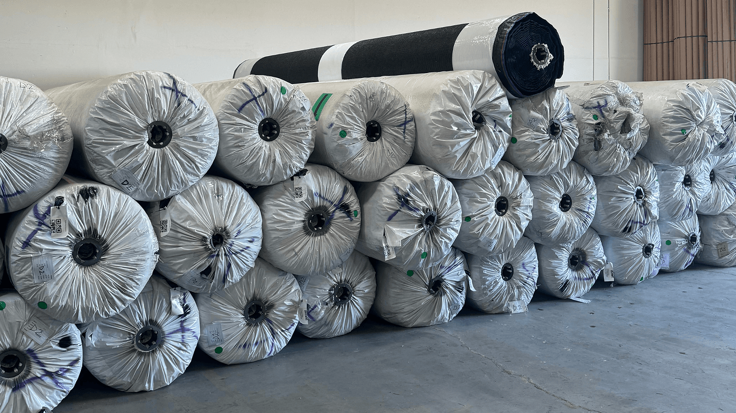 Pallets of artificial grass rolls stacked in the AGD warehouse